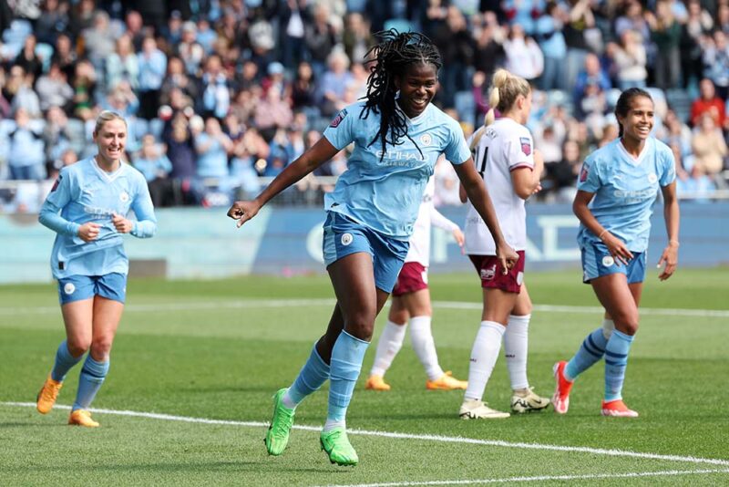 Khadija Shaw of Manchester City celebrates after scoring her team's third goal during the Barclays Women's Super League match between Manchester City and West Ham United at Manchester City Academy Stadium on April 21, 2024 in Manchester, England.