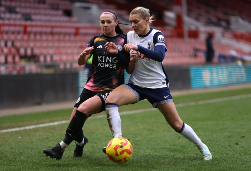 Amanda Nilden and Sam Tierney battle for the ball